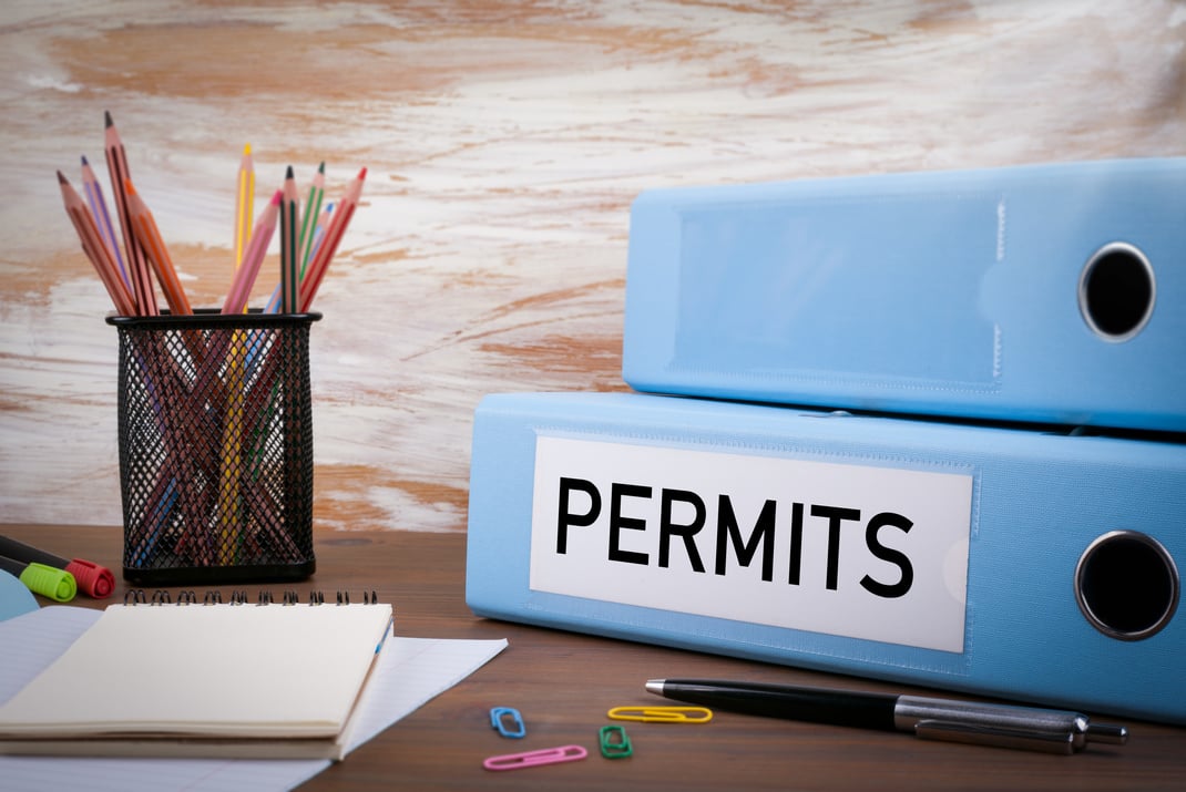 Permits, Office Binder on Wooden Desk